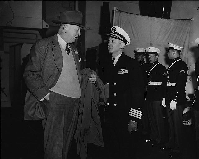 US Navy Photo dated 9 Apr 49.  Appears to be ship?s Captain Marcel E. A. Gouin and other unknown VIP.