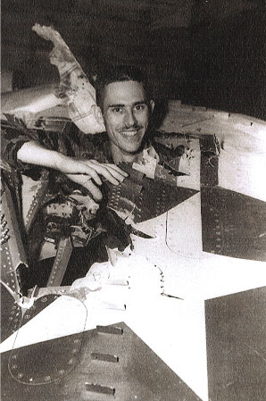Ltjg Michael Weakley stands up through his wing damage - VA-23 24 Spet 1965