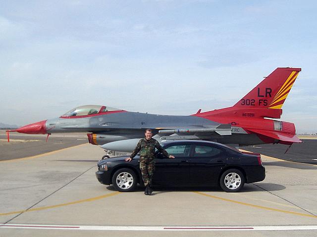 Tony Cartland, his Charger, and F-16 in squadron's WWII colors