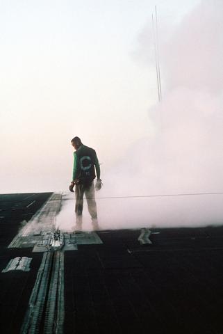Aviation Boatswain`s Mate 3rd Class Ronnie Josey inspects the shuttle on the No. 1 catapult. - 24 SEP 1991 PH1 ORIEZ