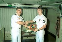 Lt. Godinez reenlisting AW2 Dickover.