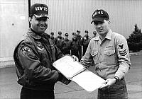 Sailor of the Month presentation by CDR Leo F. McGinn (CO) in September 1989.
