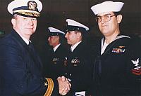 Commodore awarding air medals to (from left to right): AWC Terrence Walker, AWC Russ Bartlett, AW2 Gary Schreffler, after Desert