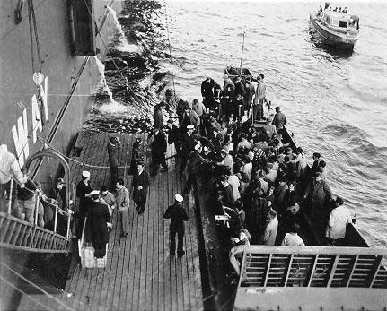 Scientists including Von Braun boarding USS Midway for Operation Sandy
