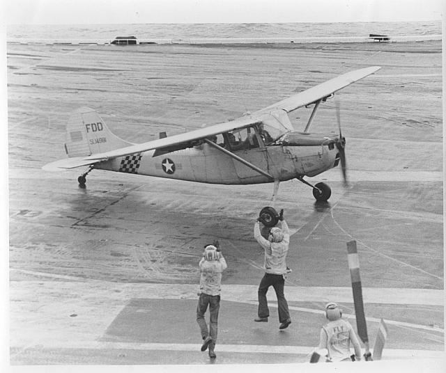 Vietnamese Maj. Bung Ly lands a Bird Dog on the Midway during the evacuation with his wife and five children onboard - courtesy