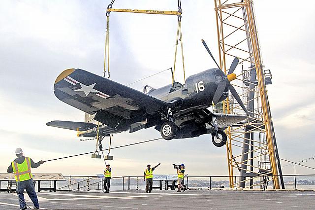 Lowering F4U Corsair to flight deck [11-11-09] - Clint Griffin photo