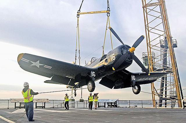 Lowering F4U Corsair to flight deck [11-11-09] - Clint Griffin photo