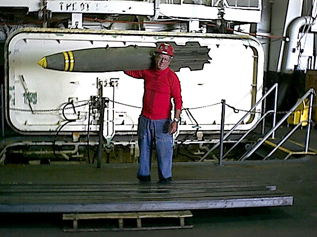 Lcdr.(AO) Solomon checking MK-82 for use