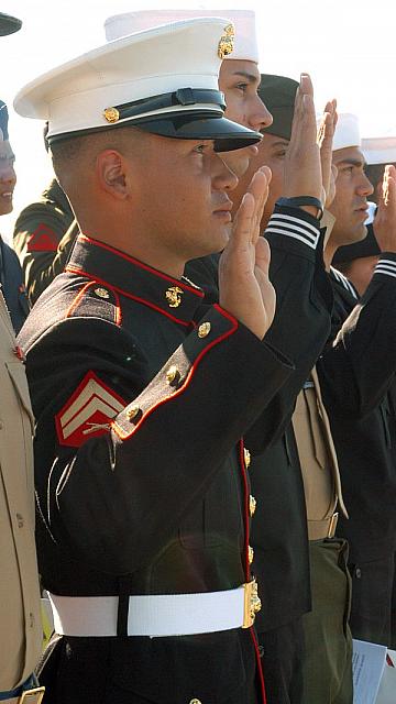 San Diego, Calif. (Nov. 8, 2006) ? U.S. Marine Cpl. John Freddy Moreno Rodriguez takes the oath of citizenship aboard USS Midway