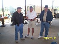 Bob Shultze, AJ "Fabio" Deese proving he can read to Rudy "Ruby" Wortham - 2007 Reunion