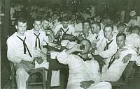 Sea Horse EM Club-- Subic Bay, P.I.--1958-59 Cruise. L. Regon in front -- L to R K. C. Zeigler - L. E. Kurpell - Red Ligon - G.