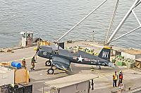 Barge with F4U Corsair approaching foot of Navy pier - Clint Griffin photo