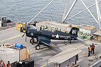 Barge with F4U Corsair approaching foot of Navy pier - Clint Griffin photo