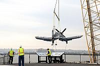 F4U Corsair being lifted over the bow [11-11-09] - Clint Griffin photo