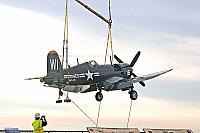 F4U Corsair being lifted over the bow [11-11-09] - Clint Griffin photo