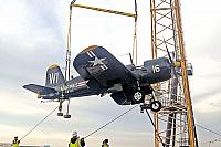 F4U Corsair being lifted over the bow [11-11-09] - Clint Griffin photo